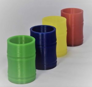 4 identical hollow cylinders 3D Printed in different colours